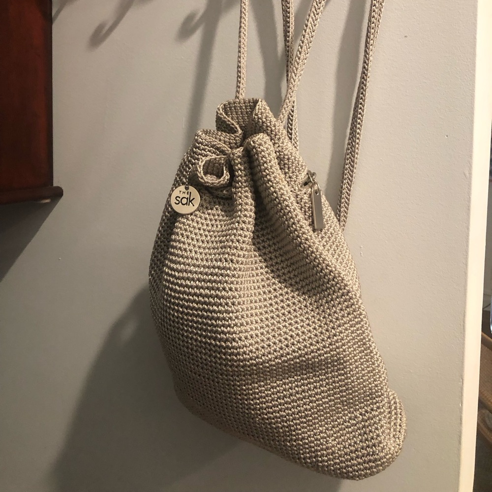 The SAK light grey/silver crochet back pack